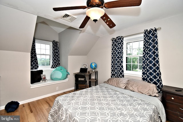 1437 Hilltop Rd, Pottstown, PA 19464 - bedroom with wood finished floors, multiple windows, lofted ceiling, and ceiling fan