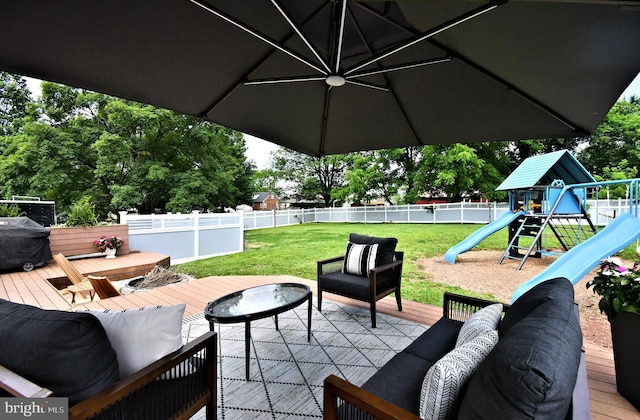 1437 Hilltop Rd, Pottstown, PA 19464 - fenced backyard with a playground, a wooden deck, outdoor lounge area, and area for grilling