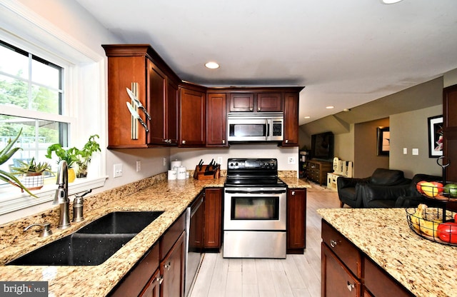1437 Hilltop Rd, Pottstown, PA 19464 - kitchen featuring stainless steel appliances, light stone countertops, open floor plan, recessed lighting, and light wood finished floors