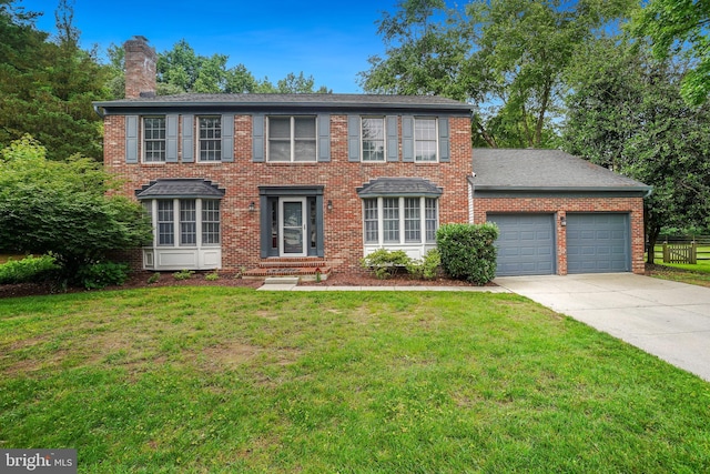 7 Somerset Ct, Annapolis, MD 21403 - colonial-style house featuring a chimney, brick siding, a garage, concrete driveway, and a front yard