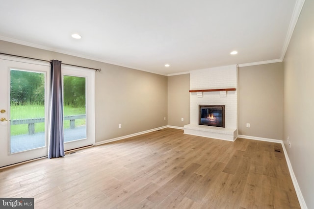7 Somerset Ct, Annapolis, MD 21403 - unfurnished living room featuring light wood-style flooring, ornamental molding, a brick fireplace, and recessed lighting