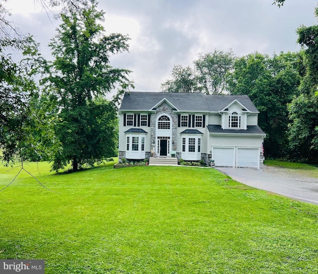 219 Emilys Way, Davidsonville, MD 21035 - colonial house featuring a garage, asphalt driveway, stone siding, and a front yard