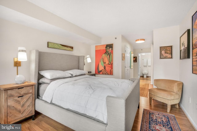 2121 Jamieson Ave Unit 707, Alexandria, VA 22314 - bedroom with wood finished floors and ensuite bath