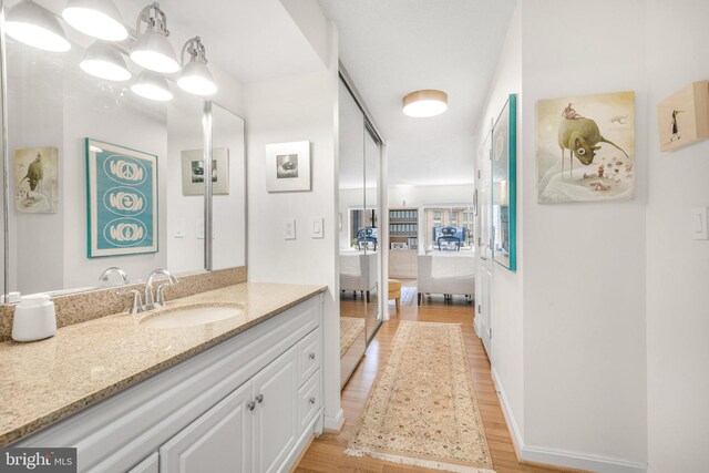 2121 Jamieson Ave Unit 707, Alexandria, VA 22314 - bathroom featuring wood finished floors and vanity