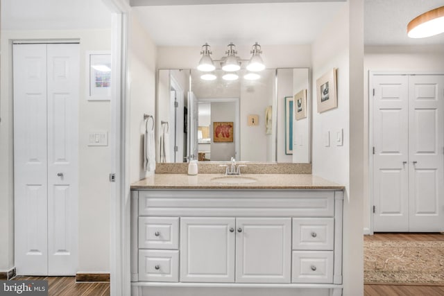 2121 Jamieson Ave Unit 707, Alexandria, VA 22314 - bathroom featuring a closet, wood finished floors, and vanity