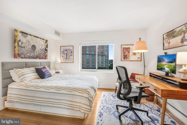 2121 Jamieson Ave Unit 707, Alexandria, VA 22314 - bedroom featuring wood finished floors and an office area