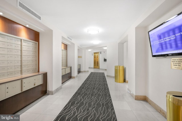 2121 Jamieson Ave Unit 707, Alexandria, VA 22314 - hall with mail area and light tile patterned floors