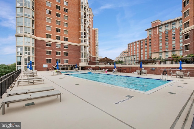 2121 Jamieson Ave Unit 707, Alexandria, VA 22314 - community pool featuring a patio area