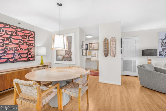 2121 Jamieson Ave Unit 707, Alexandria, VA 22314 - dining room with light wood finished floors