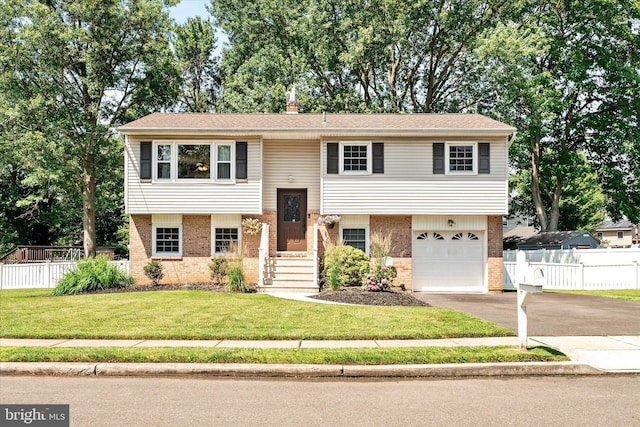 5 Wisteria Ln, Hamilton, NJ 08690 - raised ranch with brick siding, asphalt driveway, and a garage