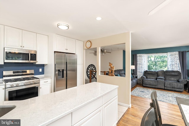 5 Wisteria Ln, Hamilton, NJ 08690 - kitchen featuring appliances with stainless steel finishes, white cabinets, ceiling fan, light wood finished floors, and recessed lighting