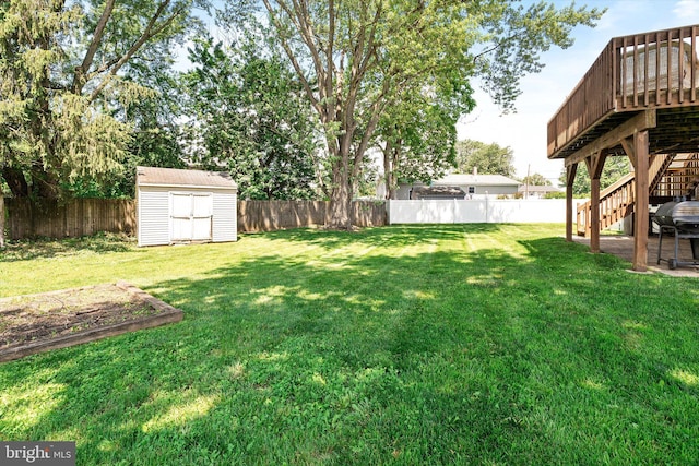 5 Wisteria Ln, Hamilton, NJ 08690 - fenced backyard with stairway, a storage unit, and a deck