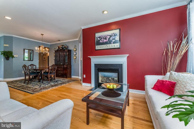 17 Paddock Ln, Flemington, NJ 08822 - living area with a chandelier, wood finished floors, ornamental molding, a fireplace with flush hearth, and recessed lighting