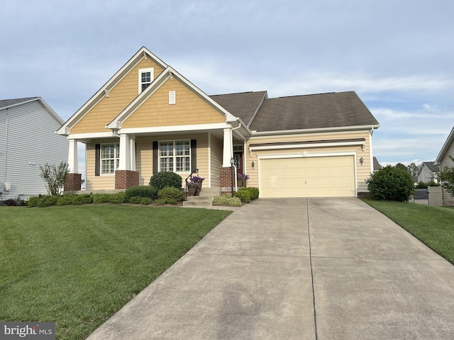 102 Friesian Ct, Stephens City, VA 22655 - craftsman house with a front yard, concrete driveway, a garage, and covered porch