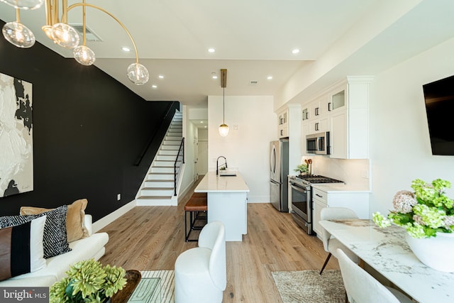 2517 Ontario Rd NW Unit Ph7, Washington, DC 20009 - living area with stairs, light wood finished floors, and recessed lighting