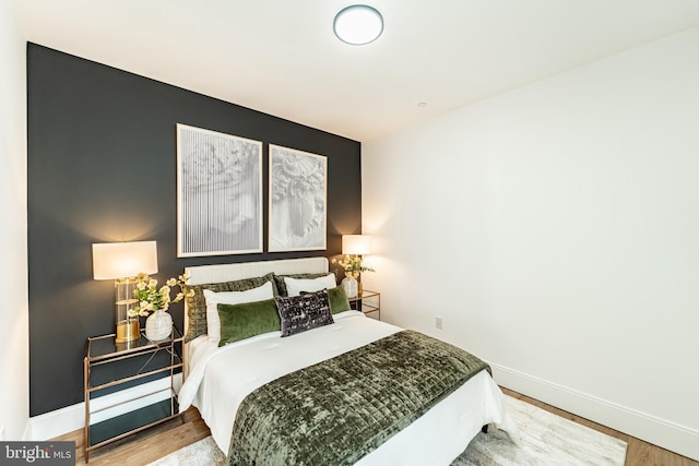 2517 Ontario Rd NW Unit Ph7, Washington, DC 20009 - bedroom featuring baseboards and wood finished floors