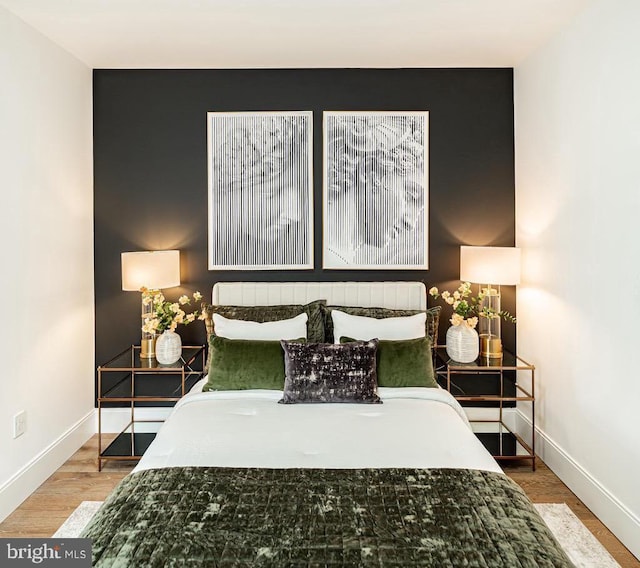 2517 Ontario Rd NW Unit Ph7, Washington, DC 20009 - bedroom with baseboards and wood finished floors