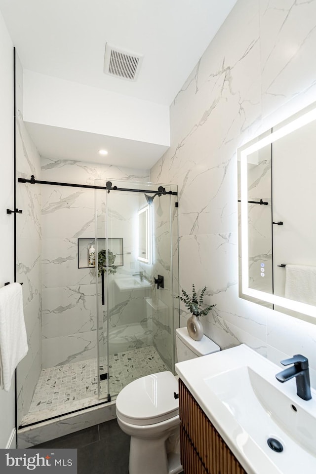 2517 Ontario Rd NW Unit Ph7, Washington, DC 20009 - full bathroom with vanity, a marble finish shower, tile walls, and tile patterned floors