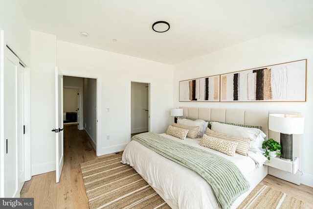 2517 Ontario Rd NW Unit Ph7, Washington, DC 20009 - bedroom featuring light wood-style flooring and a closet