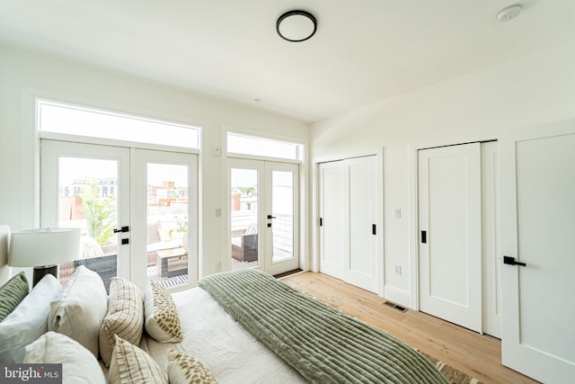 2517 Ontario Rd NW Unit Ph7, Washington, DC 20009 - bedroom featuring french doors, wood finished floors, access to exterior, and two closets