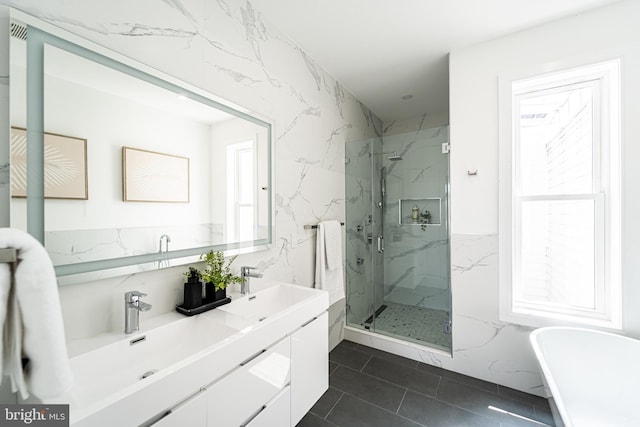 2517 Ontario Rd NW Unit Ph7, Washington, DC 20009 - bathroom featuring a marble finish shower, plenty of natural light, a freestanding tub, and double vanity