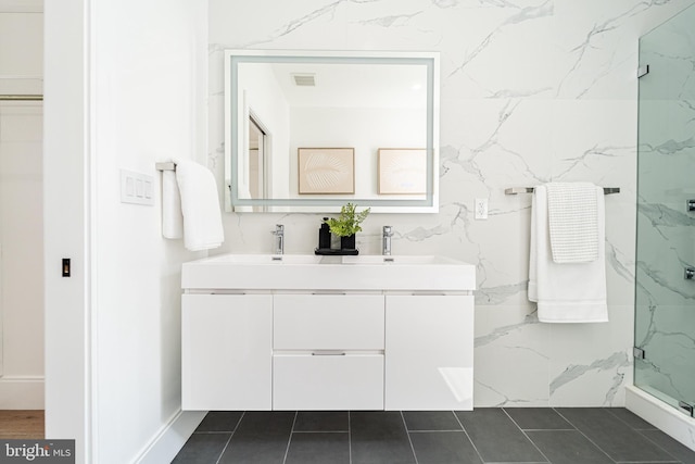 2517 Ontario Rd NW Unit Ph7, Washington, DC 20009 - bathroom featuring double vanity, a marble finish shower, and tile patterned flooring