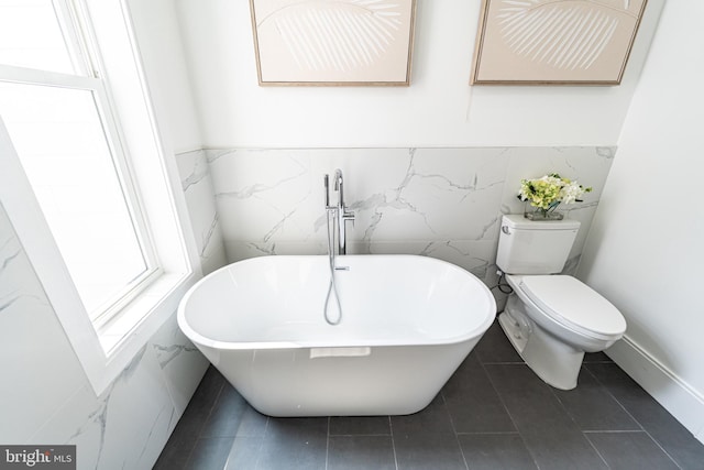 2517 Ontario Rd NW Unit Ph7, Washington, DC 20009 - full bathroom featuring a freestanding tub, tile patterned flooring, and tile walls