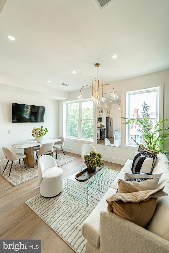 2517 Ontario Rd NW Unit Ph7, Washington, DC 20009 - living room with wood finished floors, recessed lighting, and a chandelier