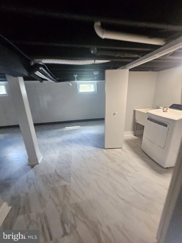 1608 Howard, Baltimore, MD 21221 - below grade area with washer / clothes dryer and light marble finish floors