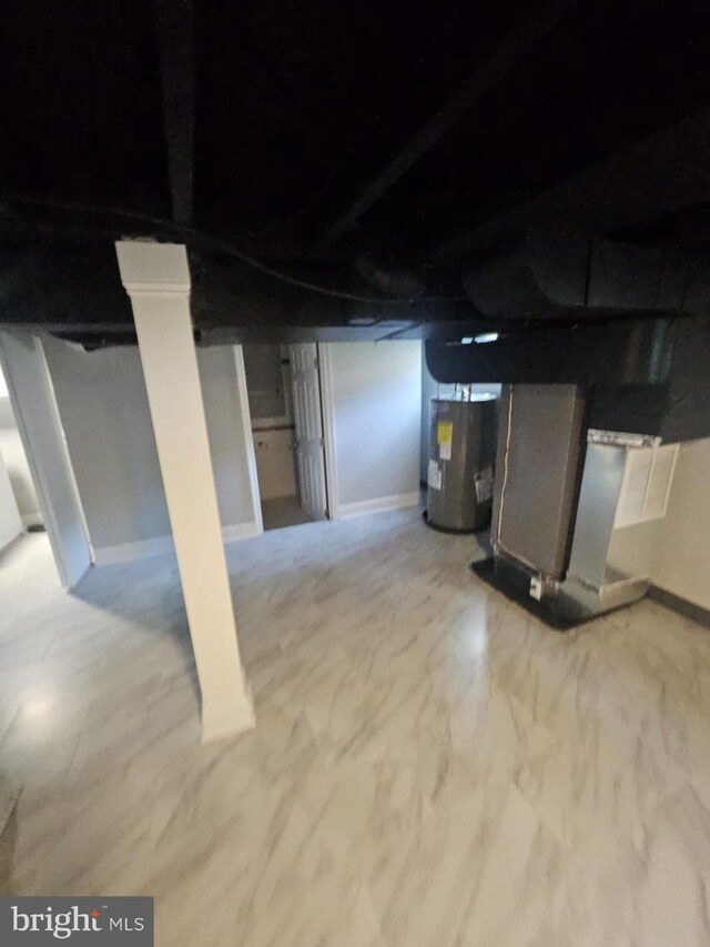 1608 Howard, Baltimore, MD 21221 - unfinished below grade area with electric water heater and heating unit