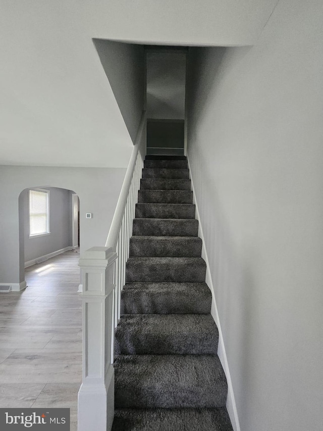 1608 Howard, Baltimore, MD 21221 - stairs featuring arched walkways and baseboards