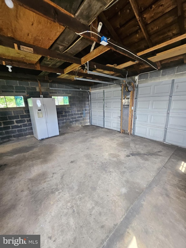 1608 Howard, Baltimore, MD 21221 - garage with white fridge with ice dispenser and concrete block wall