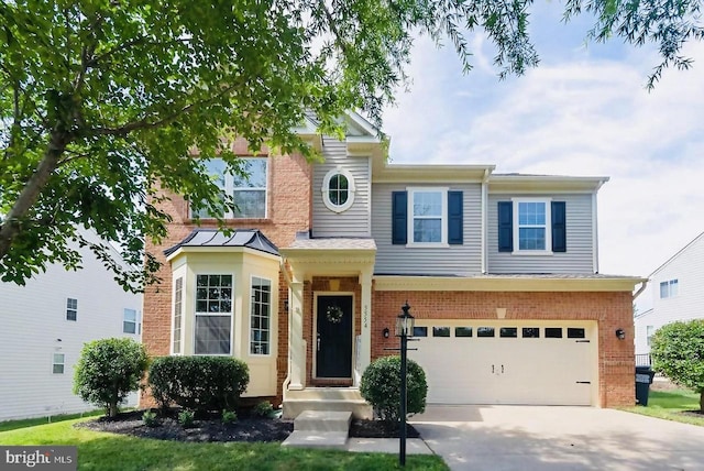 5554 Barnes Ln, Woodbridge, VA 22193 - view of front of property featuring a garage, brick siding, and concrete driveway