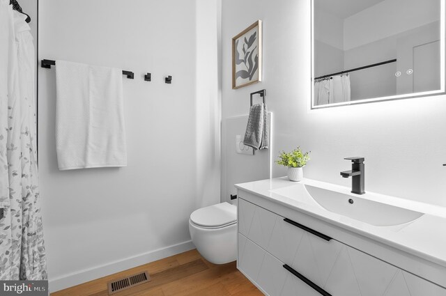 3306 E Lombard St, Baltimore, MD 21224 - bathroom featuring vanity and wood finished floors