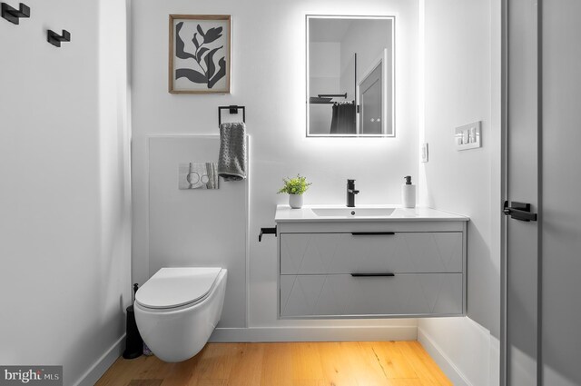 3306 E Lombard St, Baltimore, MD 21224 - bathroom with vanity and wood finished floors
