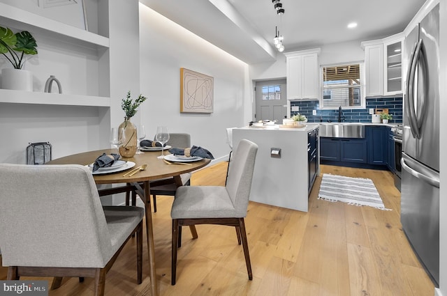 3306 E Lombard St, Baltimore, MD 21224 - dining room featuring light wood finished floors and recessed lighting