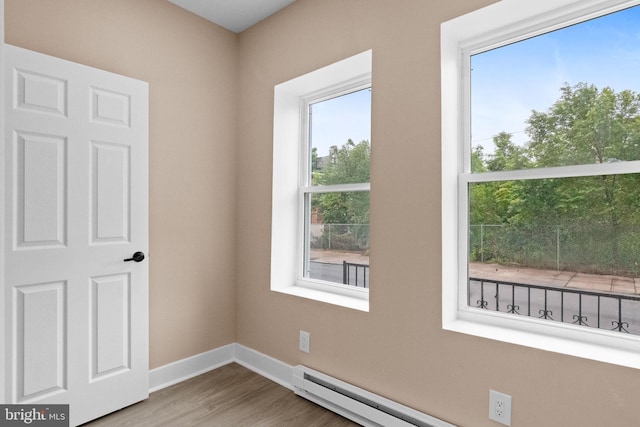 2839 N 9th St, Philadelphia, PA 19133 - unfurnished room with wood finished floors and a baseboard radiator