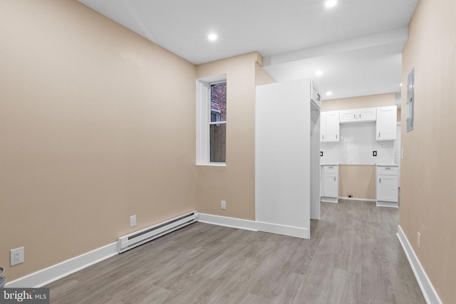 2839 N 9th St, Philadelphia, PA 19133 - spare room with a baseboard heating unit, light wood-style floors, and recessed lighting
