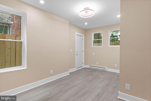2839 N 9th St, Philadelphia, PA 19133 - empty room featuring baseboard heating, wood finished floors, and recessed lighting
