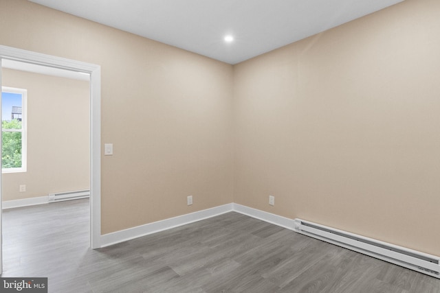 2839 N 9th St, Philadelphia, PA 19133 - empty room featuring baseboard heating, dark wood finished floors, and recessed lighting