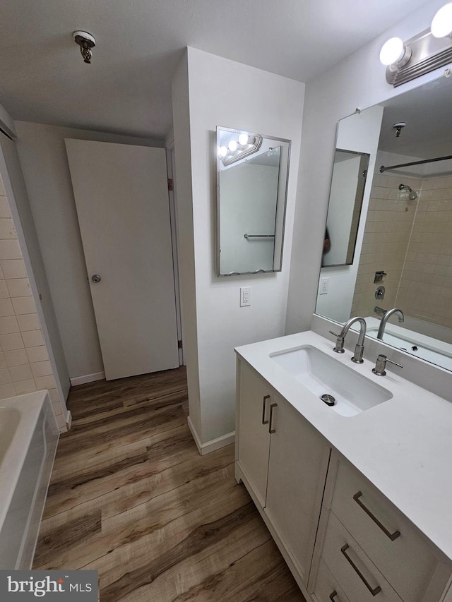 655 Absecon Blvd Unit 1002, Atlantic City, NJ 08401 - bathroom featuring vanity, wood finished floors, and bathtub / shower combination