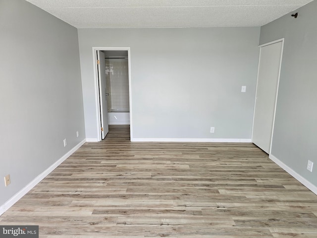 655 Absecon Blvd Unit 1002, Atlantic City, NJ 08401 - empty room featuring wood finished floors and a textured ceiling