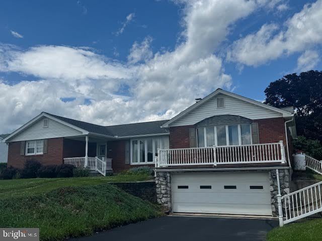 109 Ridgeview Dr, Lewistown, PA 17044 - ranch-style house featuring covered porch, an attached garage, asphalt driveway, and brick siding