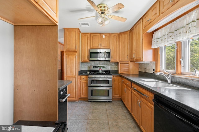 942 Paul St, Gloucester City, NJ 08030 - kitchen featuring stainless steel appliances, dark countertops, tasteful backsplash, and ceiling fan