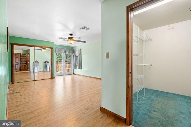 942 Paul St, Gloucester City, NJ 08030 - spare room featuring a ceiling fan, wood finished floors, and french doors