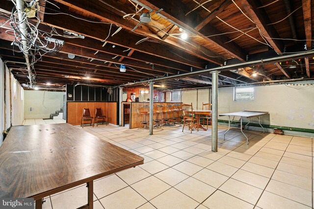 942 Paul St, Gloucester City, NJ 08030 - basement with a bar, tile patterned flooring, and stairs