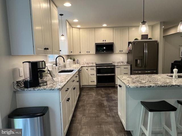 148 Five Points Rd, Mertztown, PA 19539 - kitchen featuring stainless steel microwave, refrigerator with ice dispenser, range with electric stovetop, white cabinets, and light stone countertops