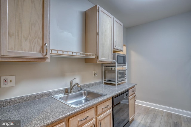 2902 Waters Edge Dr Unit 261, Newark, DE 19702 - kitchen with dishwasher, light wood-style floors, light brown cabinetry, light countertops, and stainless steel microwave