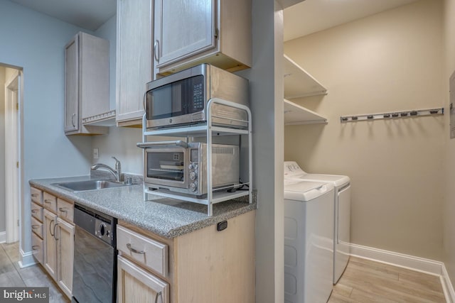 2902 Waters Edge Dr Unit 261, Newark, DE 19702 - kitchen with black dishwasher, washer and clothes dryer, light wood-style flooring, and stainless steel microwave