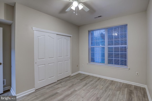 2902 Waters Edge Dr Unit 261, Newark, DE 19702 - unfurnished bedroom featuring light wood-style floors, a closet, and a ceiling fan
